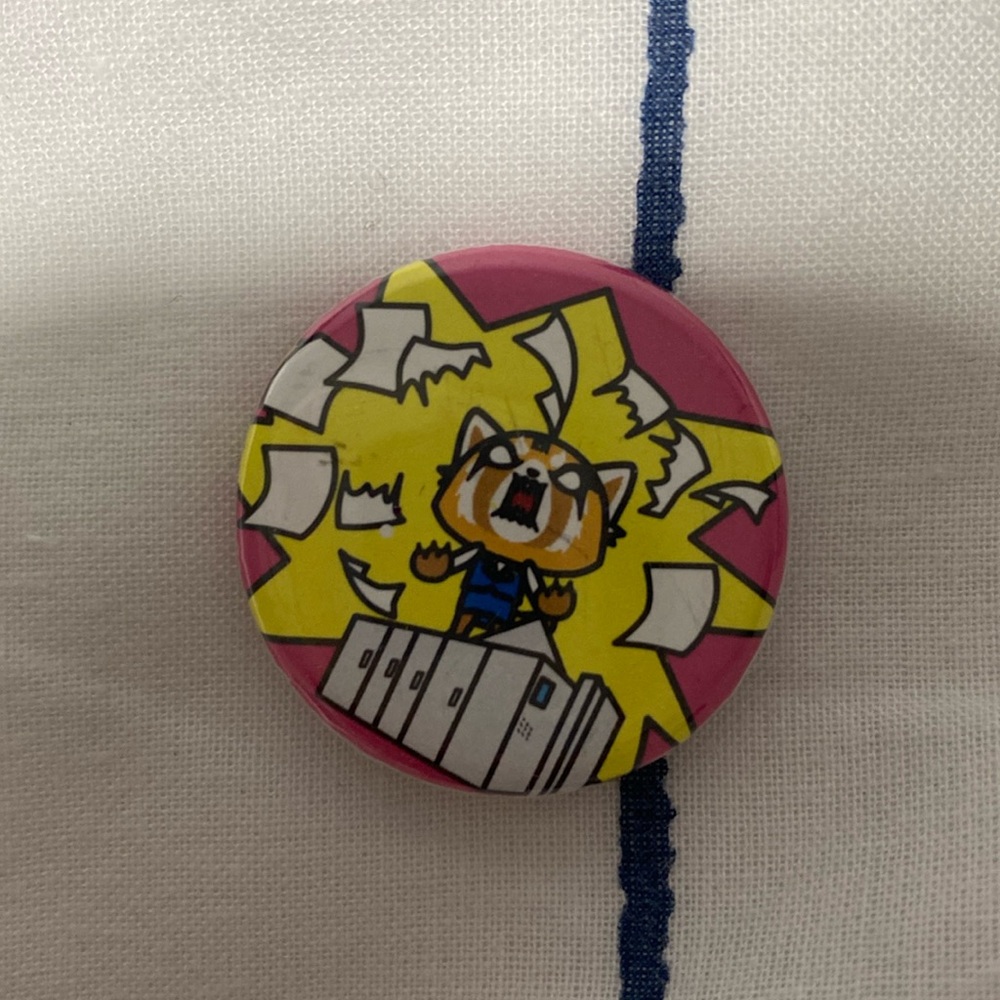 anime pink pin. not sure which anime, but it’s from sanrio. reusable.